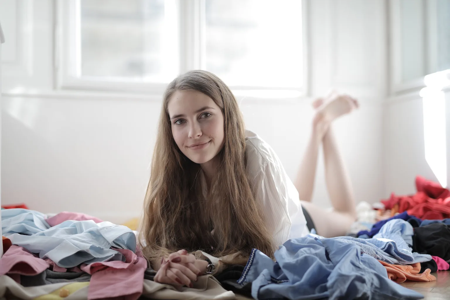 The same scene as taken, with clothes heaped on the bed