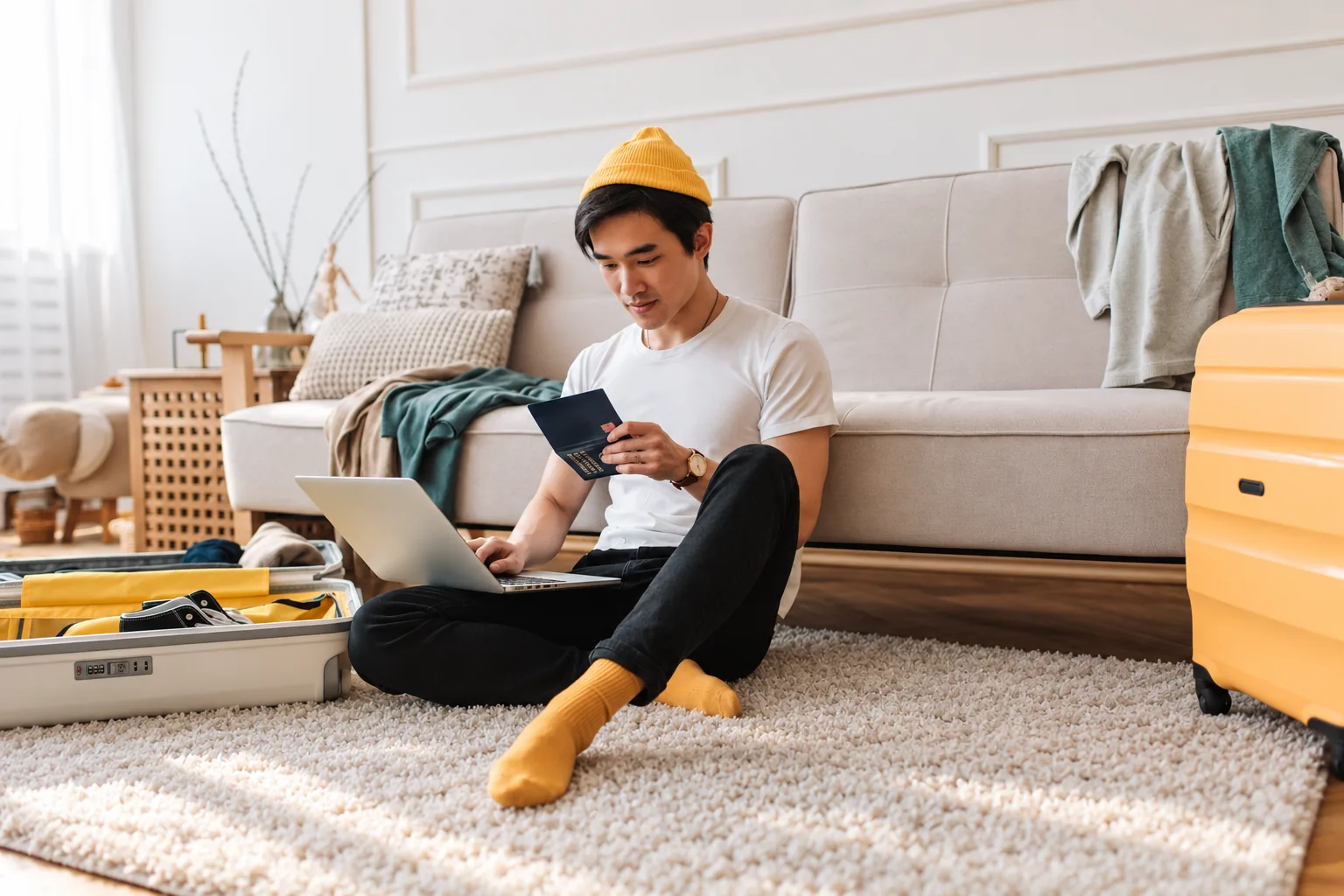 A man packing in a tidy living room